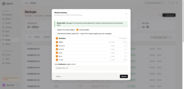 The mailbox restore dialog: a merge-safe notice, the choice between restoring whole or picking folders, every folder listed with its message count, and the address typed to confirm